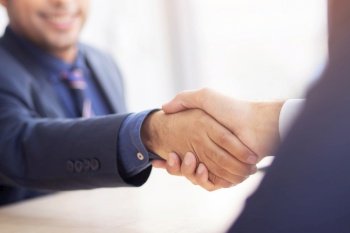 Business people shake hands to do new business together