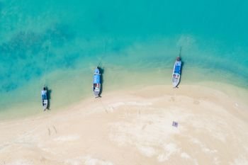 three long tail boat on the beach in Thailand aerial view