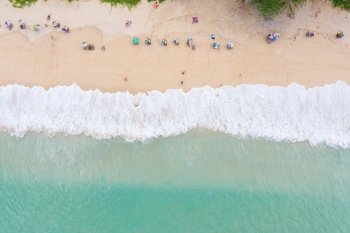 the sea wave on the beach and tourist aerial view at surin beach Phuket Thailand