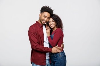 portrait of happy african american couple hug each other on white background. portrait of happy african american couple hug each other on white background.