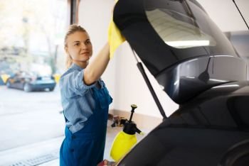 Female washer wipes wax spray, car wash service. Woman washes vehicle, carwash station, car-wash business