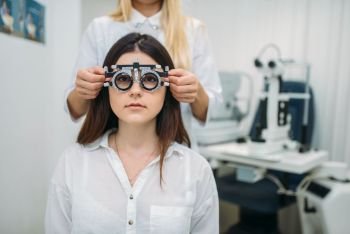 Eyesight test in optician cabinet, diagnostic of vision, professional choice of glasses. Patient and ophthalmologist, eye care consultation with specialist. Eyesight test, optician cabinet, vision diagnostic