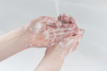 Washing thoroughly your hands with water and soap