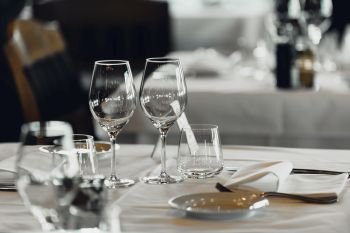 Empty wine glasses on table in restaurant