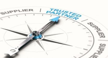 3D illustration of a compass with needdle pointing the text trusted partner. Concept of trustworthy partnership. . B2B concept, Trusted Business Partnership.