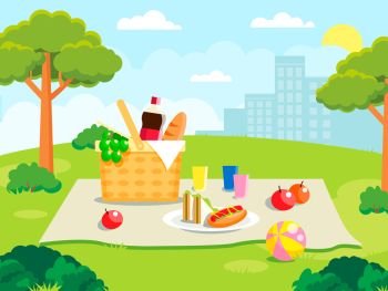 Summer picnic on forest background. Family concept with picnic party stuff. Straw basket, wine and food for outing on public park. Summer picnic on forest background. Family concept with picnic party stuff