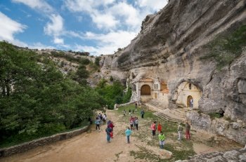 Ojo Guarena, Spain - August 15, 2015: Tourist visiting ancient cave heremitage of St Bernabe, in Burgos, Spain.