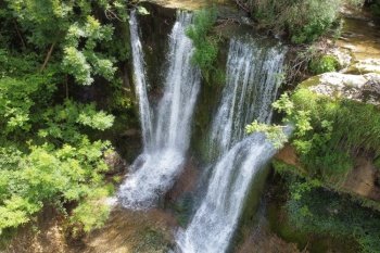  Idyllic rain forest waterfall, stream flowing in the lush green forest. High quality image..  Idyllic rain forest waterfall, stream flowing in the lush green forest.