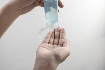 Alcohol sanitizer hand gel in a hand have Squeezing onto the palm for cleaning and used as disinfectant,Covid-19,Corona virus.