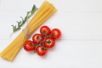Spaghetti ingredients, tomato, rosemary, concept on white background top view. Pasta ingredients concept on white background, top view