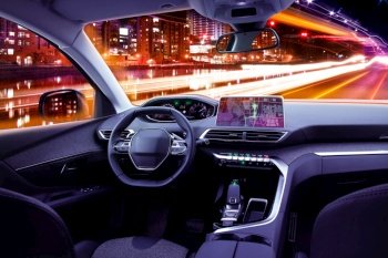 Modern car cockpit interior in night traffic, navigating or autonomous driving concept