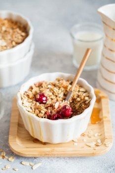 Cherry and Apricot crumble pie. Fruit Crumble with Any Kind of Fruit. Dessert with fruits, oatmeal and almonds. Berry cake, crisp in baking dish. Crispy pastry cake