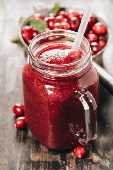 Pure fresh Cranberry smoothie on rustic wooden background - Detox, dieting, clean eating, vegetarian, vegan, fitness, healthy lifestyle concept