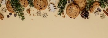 Christmas background with Chocolate chip cookies and wooden decorations, flat lay, top view. Eco friendly, zero waste Christmas
