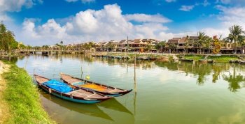Panorama of Traditional boats in Hoi An, Vietnam in a summer day