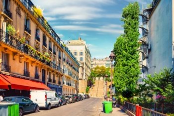 Small beautiful street in Paris, France by day