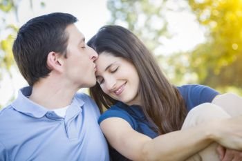 Young Attractive Couple Intimate Portrait Outdoors in the Park.