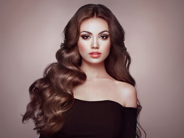 brunette girl with long healthy and shiny curly hair. care and beauty. beautiful model woman with wavy hairstyle. make up and black dress | Cheap Royalty Free Subscription, Stock Photos, Vector Illustrations brunette girl with long healthy and shiny curly hair. care and beauty. beautiful model woman with wavy hairstyle. make up and black dress | Cheap Royalty Free Subscription, Stock Photos, Vector Illustrations