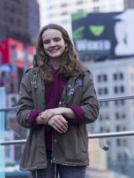 Portrait of a young woman smiling, Times Square, Midtown Manhattan, New York City, New York State, USA