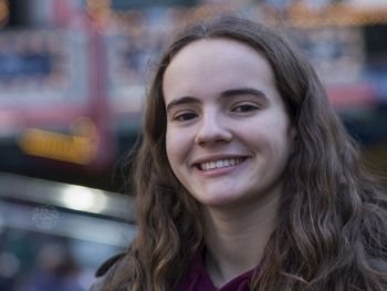 Portrait of a young woman smiling, Theater District, Times Square, Manhattan, New York City, New York State, USA