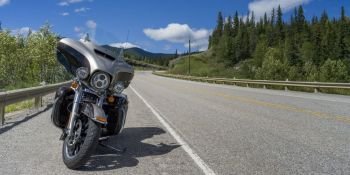 Motorcycle parked at roadside, David Thompson Highway, Clearwater County, Alberta, Canada