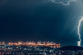 Lightning over night city, beautiful magical nighttime cityscape near the sea, lightning strikes, Beirut, Lebanon