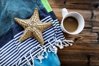Closeup Photo of a Beautiful Still Life in Beach House. Morning Coffee and Starfish. Relaxing Summer Vacation Concept.. Summer Vacation Concept
