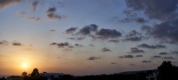 Panorama of skyscape with clouds at sunset