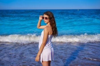 Girl in beach sea shore with summer white dress