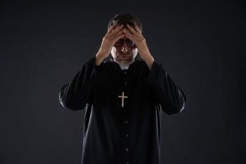 Priest male hands in head worried expression gesture
