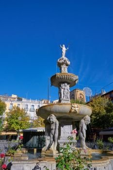 Bib Rambla square fountain of Giants in Granada of Spain