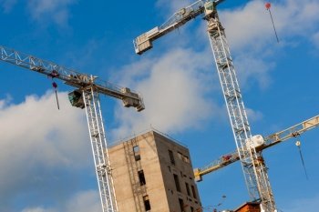 Cranes on a Construction or Building SIte with a blue sky