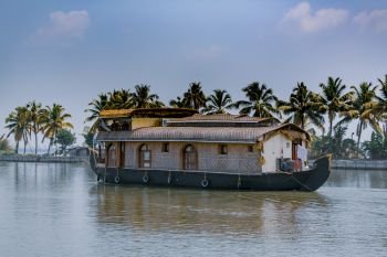 House boat sailing through Kerala backwaters