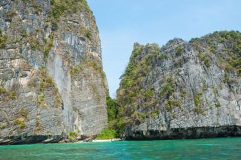 Panorama of famous Phi Phi island in Thailand with sea, boats and mountains in beautiful lagoon