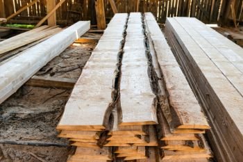 Pile of wooden planks in the timber factory