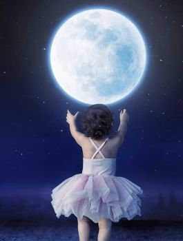 Cute baby girl reaching to the moon