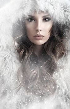 Portrait of a calm lady winter wearing a fur coat