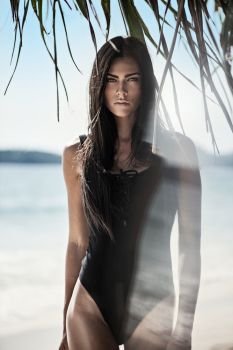 Pretty brunette woman on the tropical beach
