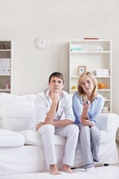 Young couple switches TV channels