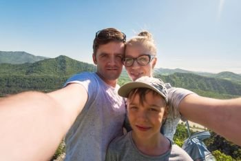 Selfie of family in mountain, beauty summer landcape. Selfie of family in mountain