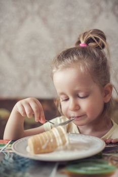 Little funny girl eats ice cream. Ice-cream and little girl