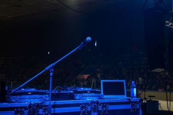 Concert stage: microphone in concert hall with blue lights. microphone in concert hall with blue lights