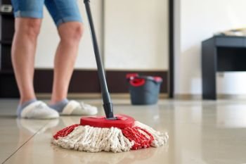 Woman Cleaning Floor with Mop
