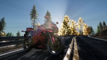 sportbike on tre road in forest with sun beams