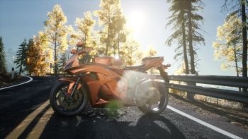 sportbike on tre road in forest with sun beams