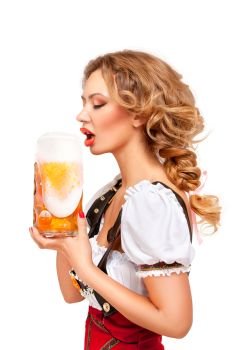 Creative concept photo of Oktoberfest waitress wearing a traditional Bavarian costume with beer isolated on white background.