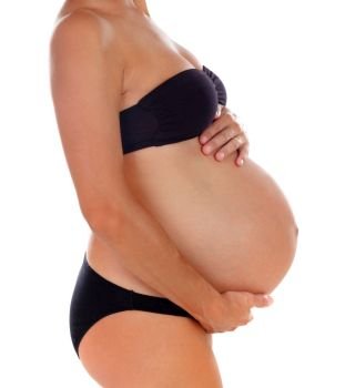 Profile of a woman during of pregnancy isolated on a white background