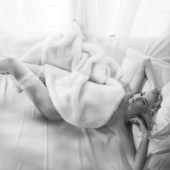 Fashion art photo of beautiful sensual woman in white stockings in her boudoir. Home bedroom interior. Beautiful morning. Summer sunset. Bridal moments                             