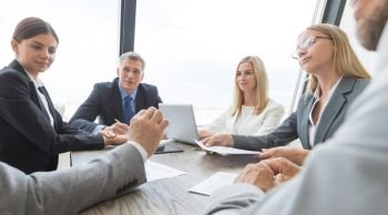 Group of Business people discussing a financial documents at meeting. Business people discussing a finance