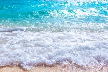 Wave of sea on sand beach beautiful natural background , seaside vacation concept. Wave of sea on sand beach